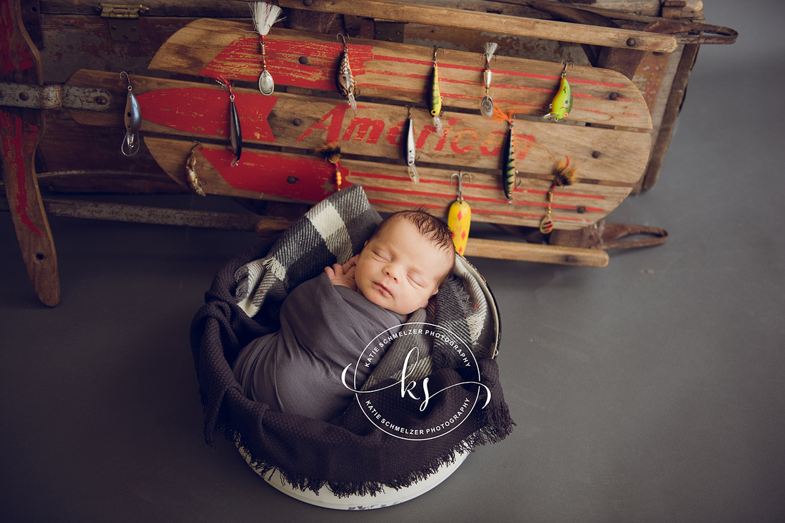 Iowa Newborn baby boy during newborn portraits with family photographed by IA Newborn and Family photographer  KS Photography