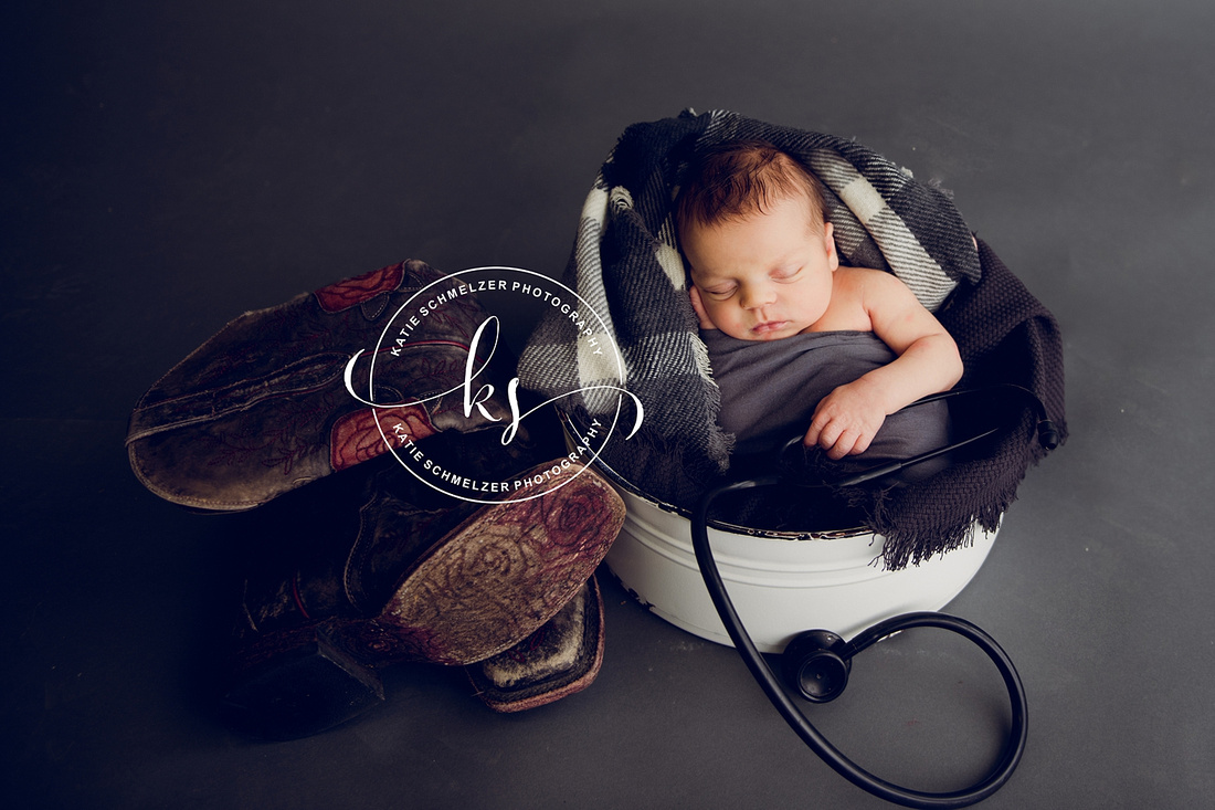 Iowa Newborn baby boy during newborn portraits with family photographed by IA Newborn and Family photographer  KS Photography