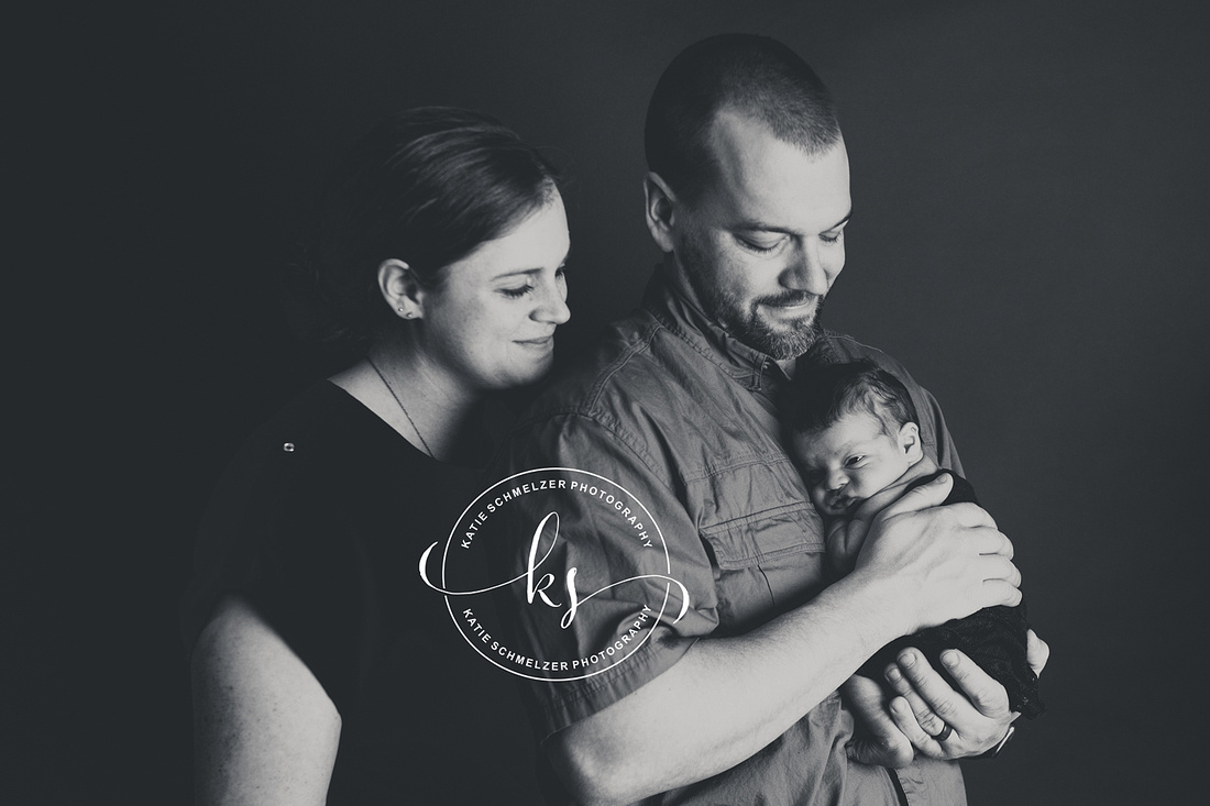 Iowa Newborn baby boy during newborn portraits with family photographed by IA Newborn and Family photographer  KS Photography