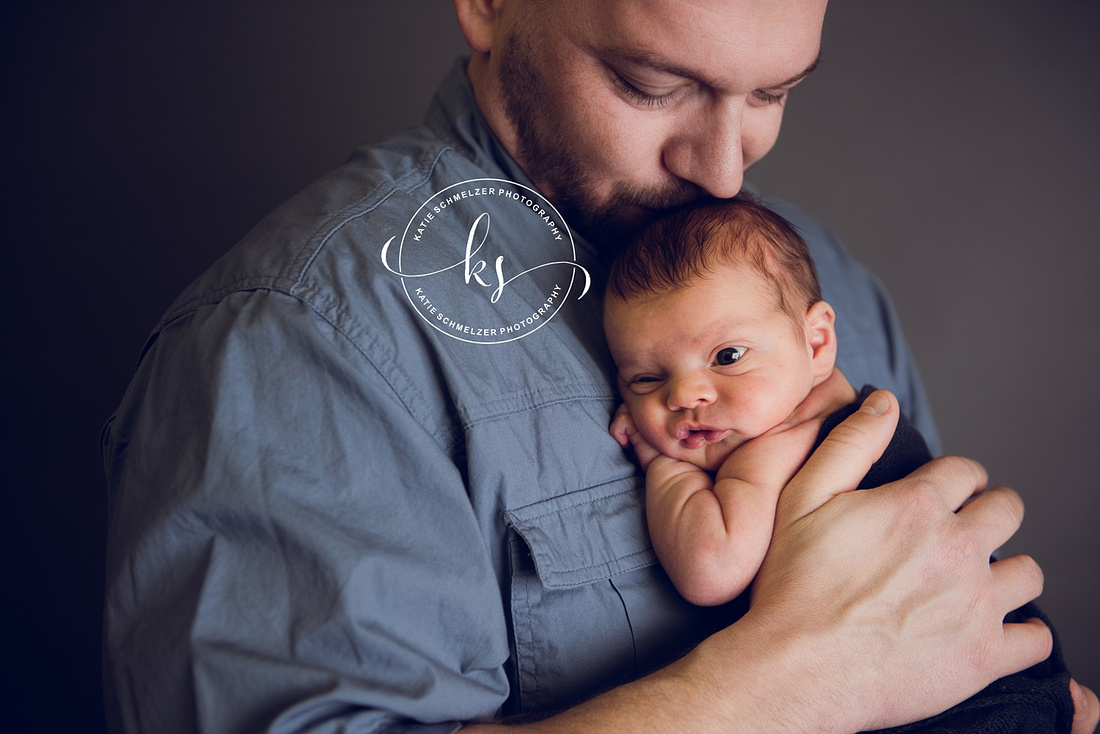 Iowa Newborn baby boy during newborn portraits with family photographed by IA Newborn and Family photographer  KS Photography