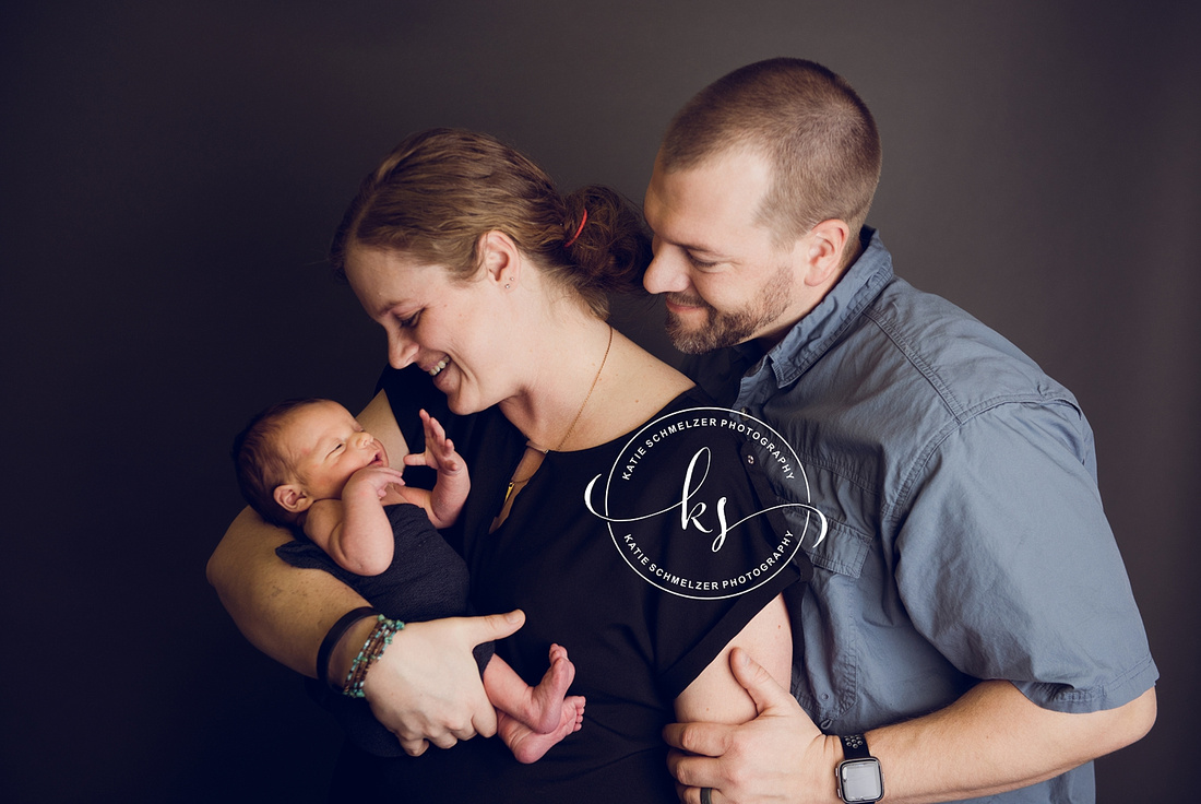 Iowa Newborn baby boy during newborn portraits with family photographed by IA Newborn and Family photographer  KS Photography