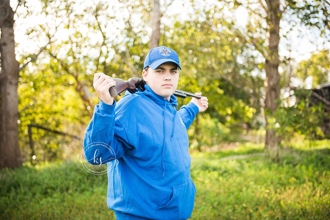 Senior portraits on family farm in Iowa with KS Photography