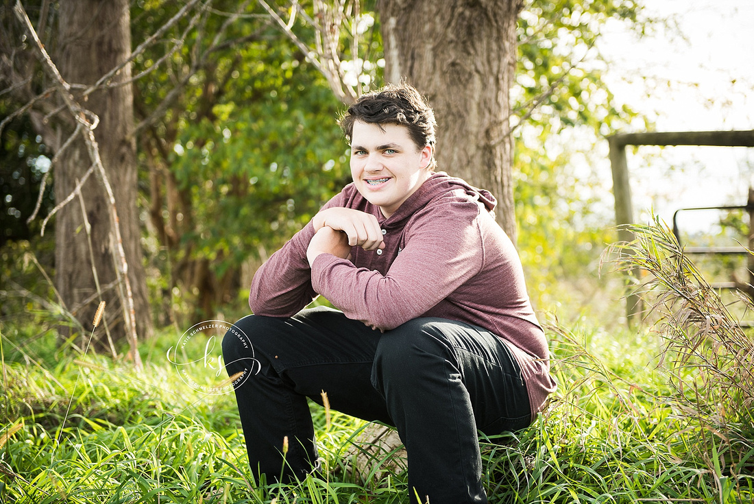 Senior portraits on family farm in Iowa with KS Photography