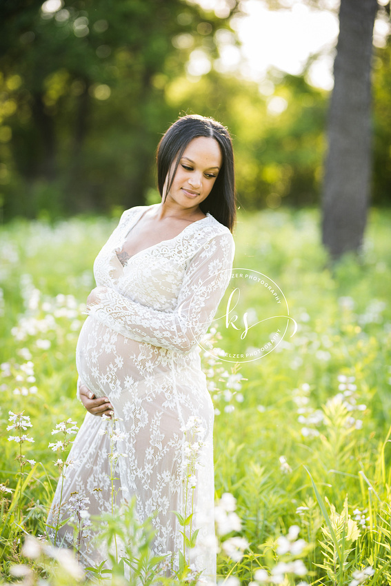 Classic summer maternity session in Iowa field with mom in white gown photographed by Tiffin IA photographer, KS Photography.