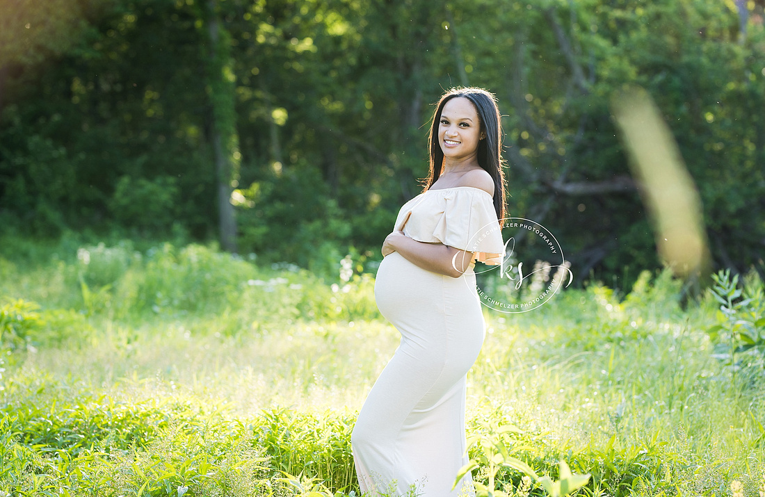 Classic summer maternity session in Iowa field with mom in white gown photographed by Tiffin IA photographer, KS Photography.