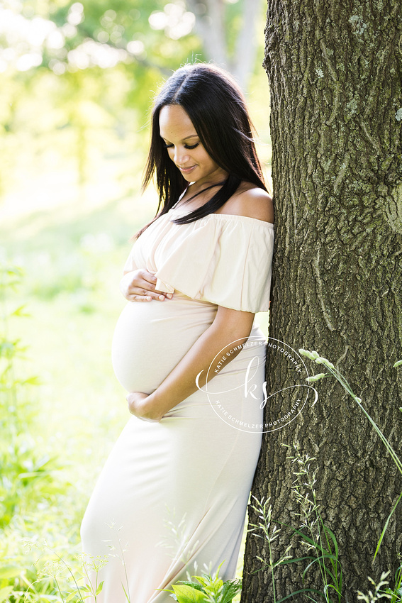 Classic summer maternity session in Iowa field with mom in white gown photographed by Tiffin IA photographer, KS Photography.