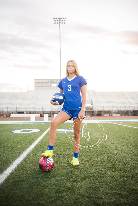 Senior portraits with soccer star in Tiffin IA photographed by KS Photography