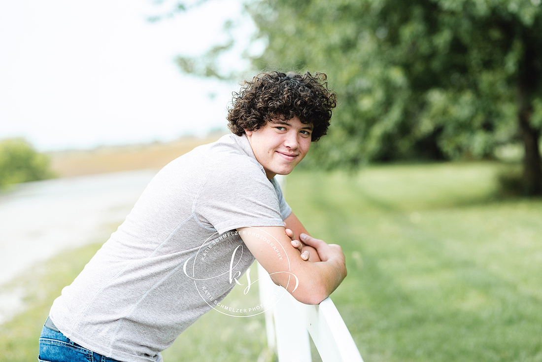 Senior portraits on family farm in Iowa with KS Photography